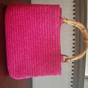 Vibrant pink wicker handbag